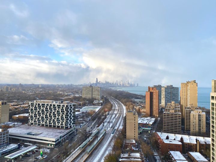 view of chicago looking north from hyde park in partly cloudy skies