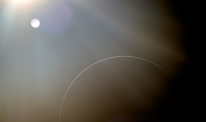NASA photo from an Apollo mission, showing circular lens flares. 